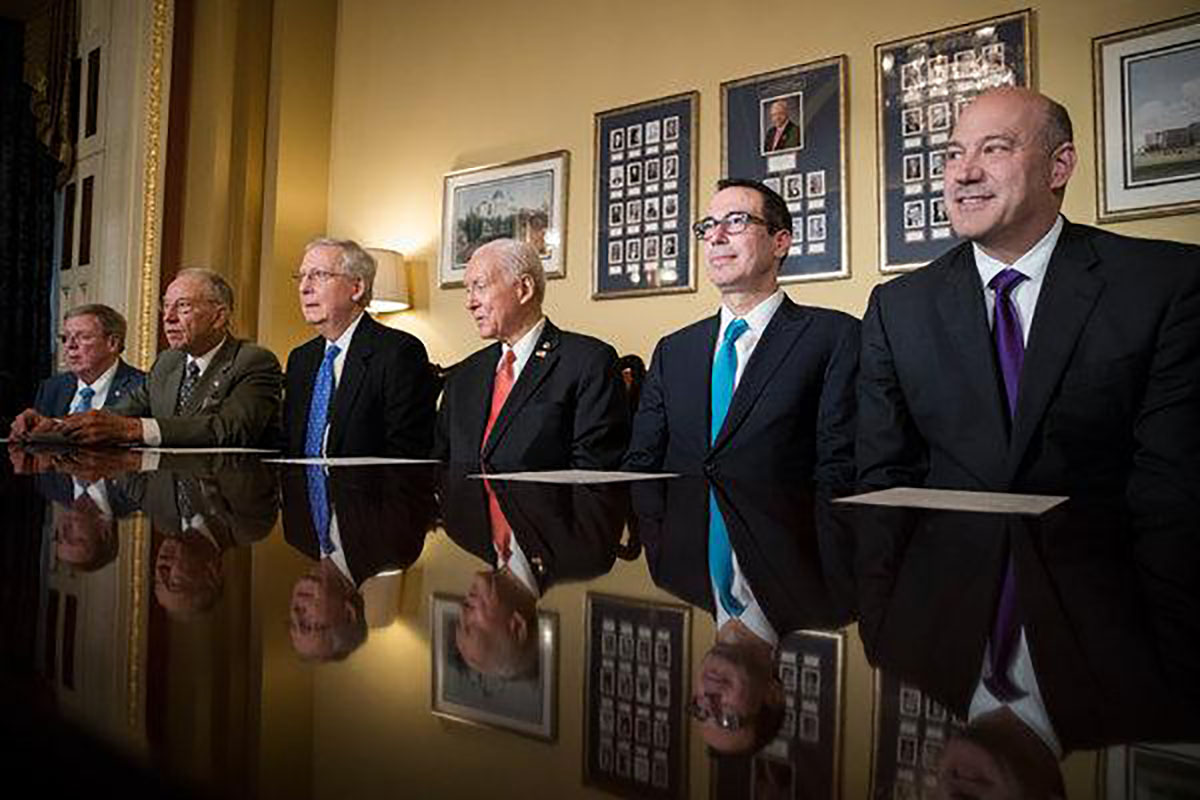 From right, Gary D. Cohn, director of National Economic Council, and Treasury Secretary Steven Mnuchin with lawmakers in November to discuss tax legislation. Photo source: Tom Brenner/The New York Times