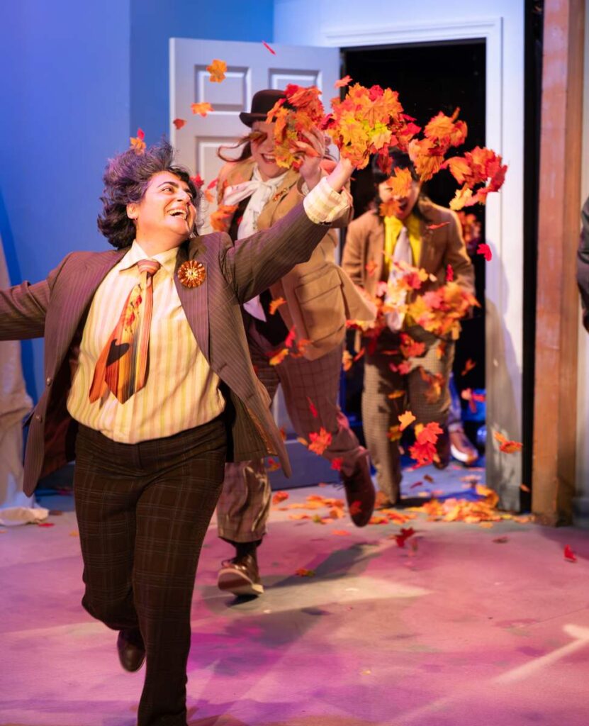 A scene from The Fall Show with autumn leaves flying